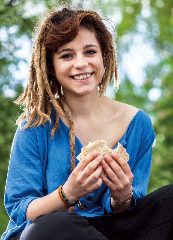 Teen girl with sandwich